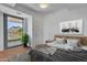 Modern bedroom with a mountain view from the balcony, light wood floors, and stylish black and white accents at 7121 E Rancho Vista Dr # 4004, Scottsdale, AZ 85251