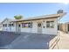 White brick ranch home with covered entry and carport at 7243 E Portland St, Scottsdale, AZ 85257