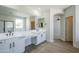 Elegant bathroom with double vanity, large mirror, and modern fixtures at 718 E Scorpio Pl, Chandler, AZ 85249