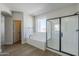 Spa-like bathroom with soaking tub, walk-in shower, and neutral tones at 718 E Scorpio Pl, Chandler, AZ 85249