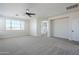 Large bedroom with ceiling fan, window, and ensuite bathroom access at 718 E Scorpio Pl, Chandler, AZ 85249