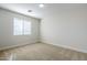 Spacious bedroom featuring a large window with blinds and neutral walls at 718 E Scorpio Pl, Chandler, AZ 85249