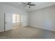 Bright bedroom with neutral carpeting and double doors at 718 E Scorpio Pl, Chandler, AZ 85249