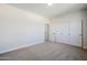 Bright bedroom with plush carpeting and ample closet space at 718 E Scorpio Pl, Chandler, AZ 85249