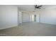 Well-lit bedroom with ceiling fan and access to additional rooms at 718 E Scorpio Pl, Chandler, AZ 85249