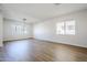 Bright dining room with hardwood floors and modern chandelier at 718 E Scorpio Pl, Chandler, AZ 85249
