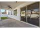 Covered patio with ceiling fan and sliding glass doors at 718 E Scorpio Pl, Chandler, AZ 85249