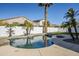 Relaxing kidney-shaped pool with spacious surrounding patio at 718 E Scorpio Pl, Chandler, AZ 85249