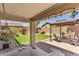 Covered patio, grassy lawn, and pergola at 18390 W Hayden Dr, Surprise, AZ 85374