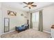 Charming bedroom with window seating and ceiling fan at 18390 W Hayden Dr, Surprise, AZ 85374