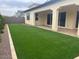 The backyard showcases a well-kept lawn and a covered patio, ideal for outdoor living at 2134 W Rowel Rd, Phoenix, AZ 85085