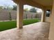 Covered patio and a well-manicured lawn offer a serene outdoor experience at 2134 W Rowel Rd, Phoenix, AZ 85085