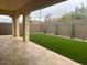 A covered patio leads out to a well-maintained lawn perfect for entertaining at 2134 W Rowel Rd, Phoenix, AZ 85085