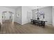 Elegant dining room with contemporary chandelier, neutral decor, and natural light at 2134 W Rowel Rd, Phoenix, AZ 85085