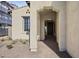 Covered entryway with arched walkway and tile flooring at 2134 W Rowel Rd, Phoenix, AZ 85085