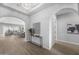 Bright foyer showcases arched doorways, a decorative mirror, and a view into the living room at 2134 W Rowel Rd, Phoenix, AZ 85085