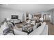 Open-concept living room with modern decor, an entertainment center, and plenty of seating at 2134 W Rowel Rd, Phoenix, AZ 85085