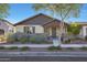 Charming single-story home featuring well-manicured landscaping and a welcoming front porch at 2342 N Delaney Dr, Buckeye, AZ 85396