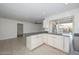 Modern kitchen featuring white cabinets and a large kitchen island at 12436 N 48Th Dr, Glendale, AZ 85304