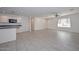 Open living room and kitchen area with tile flooring throughout at 12436 N 48Th Dr, Glendale, AZ 85304