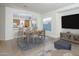 Dining area with a view into the kitchen and access to the living room at 6847 S St Andrews Way, Gilbert, AZ 85298