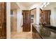 Well-appointed bathroom with dual sinks, granite countertops, walk-in shower, and a luxurious soaking tub at 9216 E Sky Line Dr, Scottsdale, AZ 85262
