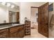 Primary bathroom featuring dual vanities, granite countertops, and a separate soaking tub for ultimate relaxation at 9216 E Sky Line Dr, Scottsdale, AZ 85262
