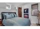 Comfortable bedroom featuring blue bedding and minimalist decor for peaceful relaxation at 9216 E Sky Line Dr, Scottsdale, AZ 85262