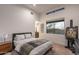 Bright bedroom with clerestory windows, side table, and artwork on display at 9216 E Sky Line Dr, Scottsdale, AZ 85262