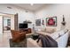 Inviting living room with a large sectional sofa, leather chair, and unique decor at 9216 E Sky Line Dr, Scottsdale, AZ 85262