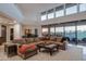 Expansive living room with high ceilings, large windows, and comfortable sectional at 9216 E Sky Line Dr, Scottsdale, AZ 85262