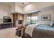 Relaxing main bedroom with fireplace, private balcony access, and neutral tones for a serene atmosphere at 9216 E Sky Line Dr, Scottsdale, AZ 85262
