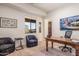 This bright office space boasts a large window, comfortable chairs and a beautiful desk at 9216 E Sky Line Dr, Scottsdale, AZ 85262