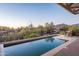 Infinity edge pool offering panoramic desert views and inviting outdoor seating at 9216 E Sky Line Dr, Scottsdale, AZ 85262