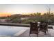 Outdoor pool and patio with desert views at sunset, creating a relaxing oasis at 9216 E Sky Line Dr, Scottsdale, AZ 85262