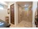 Walk-in shower featuring tile surround, glass enclosure, and chrome fixtures, exuding a clean and modern feel at 9216 E Sky Line Dr, Scottsdale, AZ 85262