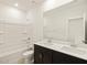 Bathroom with double vanity and shower/tub combo at 16014 W Cottontail Ln, Surprise, AZ 85387