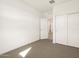 Bedroom with double door closet and access to hallway at 16014 W Cottontail Ln, Surprise, AZ 85387