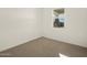 Bright bedroom with carpeted floor and window at 16014 W Cottontail Ln, Surprise, AZ 85387
