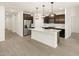 Open concept kitchen with stainless steel appliances at 16014 W Cottontail Ln, Surprise, AZ 85387