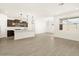 Modern kitchen with island and dark cabinetry at 16014 W Cottontail Ln, Surprise, AZ 85387