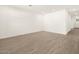 Spacious living room with wood-look flooring at 16014 W Cottontail Ln, Surprise, AZ 85387