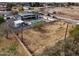 Aerial view of a property showcasing a modern home, pool, outbuildings, and expansive lot at 23325 S 132Nd St, Chandler, AZ 85249