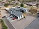 Aerial view of a modern home featuring a metal roof, gravel landscaping, and ample parking at 23325 S 132Nd St, Chandler, AZ 85249