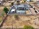 Overhead view of modern home with pool, covered patio, fenced yard, and low-maintenance landscaping at 23325 S 132Nd St, Chandler, AZ 85249