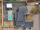 Top-down shot of backyard with a sparkling pool, covered seating area, and gravel landscaping at 23325 S 132Nd St, Chandler, AZ 85249
