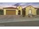 Single-story home with terracotta tile roof, neutral exterior, and landscaped front yard at 27552 W Tonopah Dr, Buckeye, AZ 85396