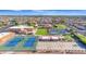 Sunland Village aerial view highlighting tennis courts, pool, shuffleboard, community center, and beautiful landscaping at 4019 E Calypso Ave, Mesa, AZ 85206