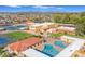 Aerial shot of Sunland Village's amenities: pool, clubhouse, tennis courts, and scenic views of the community at 4019 E Calypso Ave, Mesa, AZ 85206