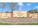 Entrance sign to Sunland Village Golf Club, featuring well-maintained landscaping and a clear, sunny sky at 4019 E Calypso Ave, Mesa, AZ 85206